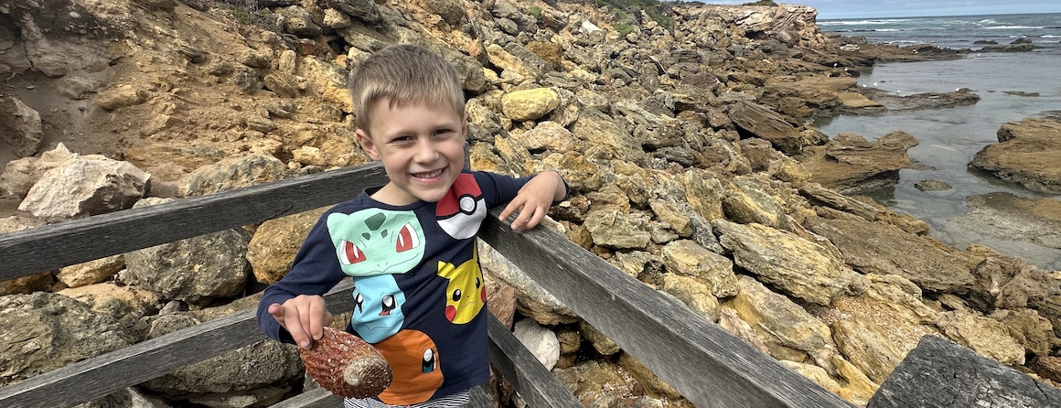 Cancer patient Oliver smiling at the beach